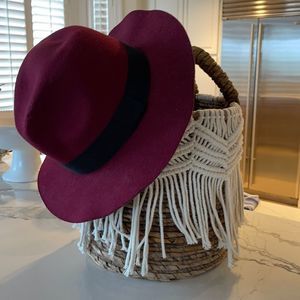 Maroon Marcus Adler hat.